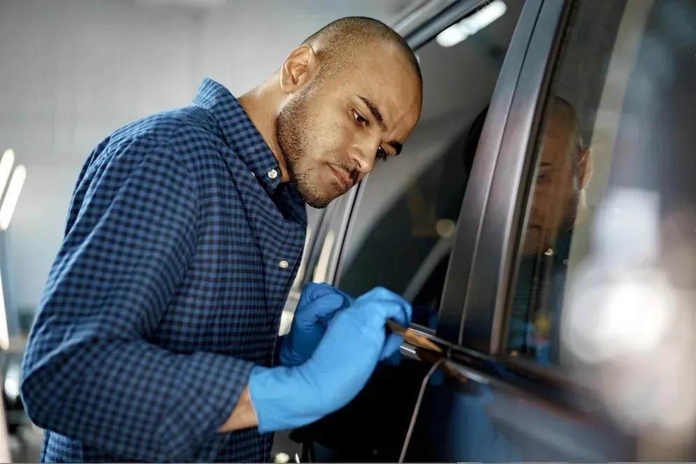african-american-man-car-service-worker-applying-nano-coating-car_93675-136503_1_-transformed