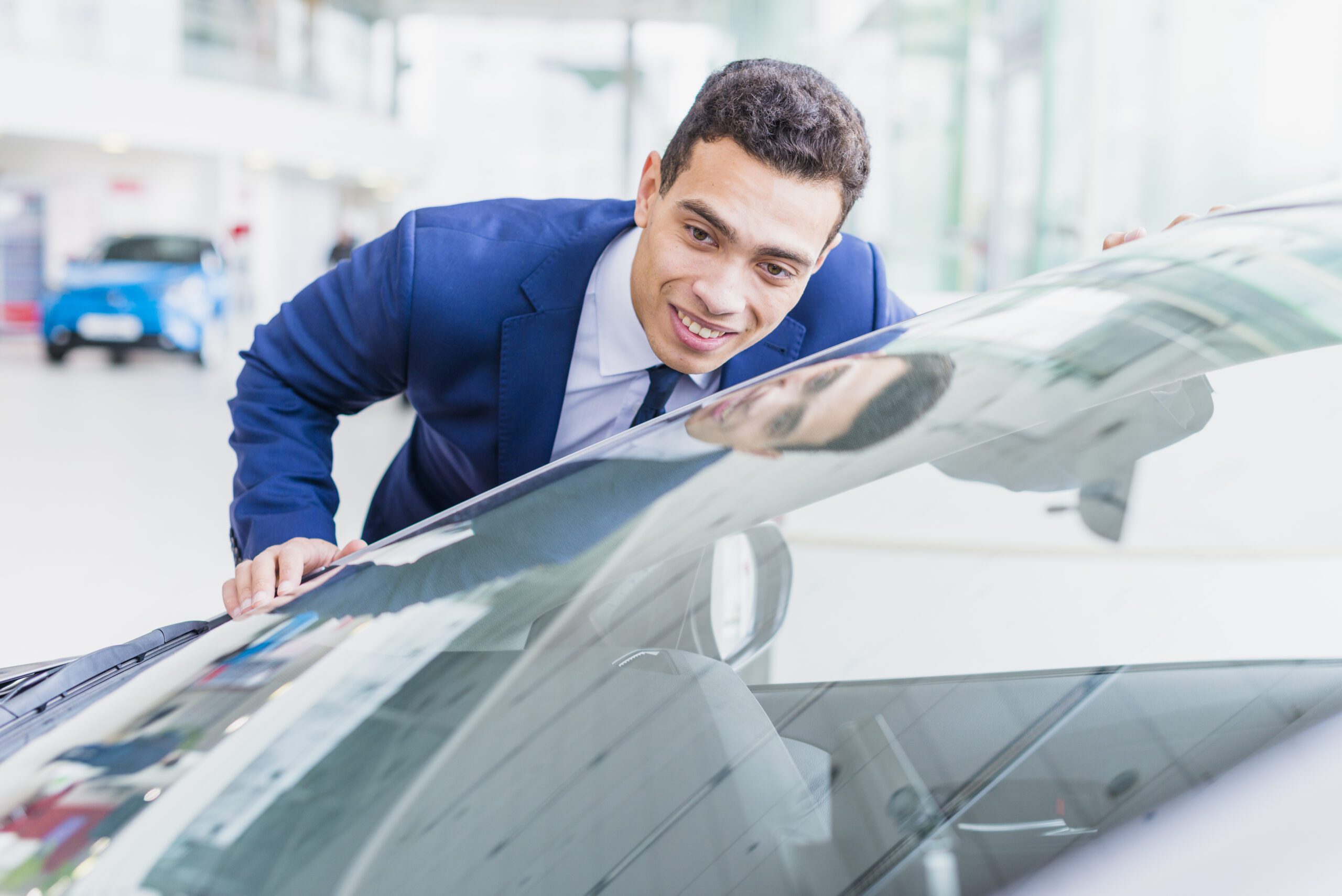 portrait-salesman-car-dealership